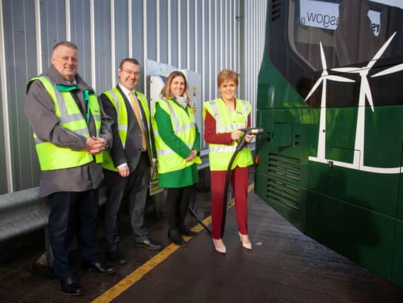 Nicola Sturgeon charging up one of the electric buses today at First Glasgow's Caledonia depot. Picture: SP Energy Networks