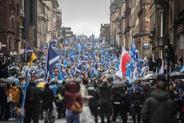 Pro-independence marchers make their way along West George Street in Glasgow on Saturday. Picture: John Devlin