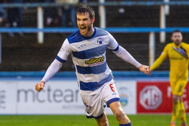 Kyle Jacobs celebrates drawing hosts Morton level at a rain-soaked Cappielow. Picture: SNS.