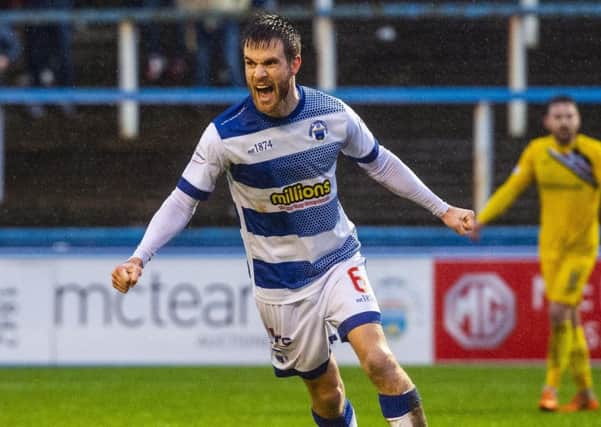 Kyle Jacobs celebrates drawing hosts Morton level at a rain-soaked Cappielow.  Picture: SNS.
