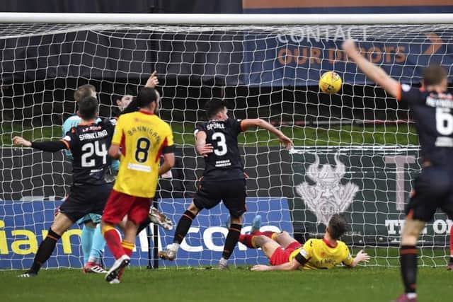 Adrian Sporle, centre, scores to make it 2-0 to Dundee United. Picture: Rob Casey/SNS Group