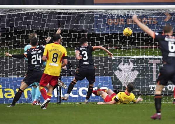 Adrian Sporle, centre, scores to make it 2-0 to Dundee United. Picture: Rob Casey/SNS Group