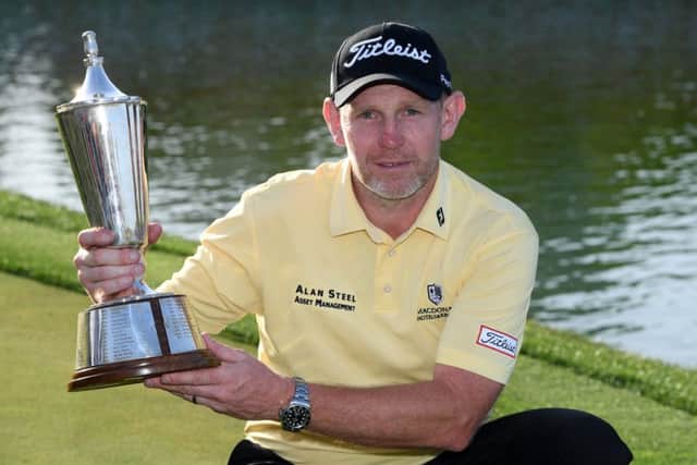 Stephen Gallacher poses with the trophy after winning the Hero Indian Open in March, his fourth career victory. Picture: Ross Kinnaird/Getty Images