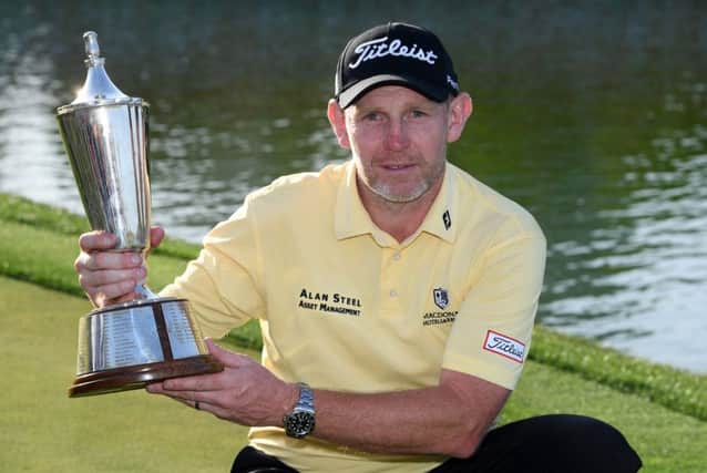 Stephen Gallacher poses with the trophy after winning the Hero Indian Open in March, his fourth career victory. Picture: Ross Kinnaird/Getty Images