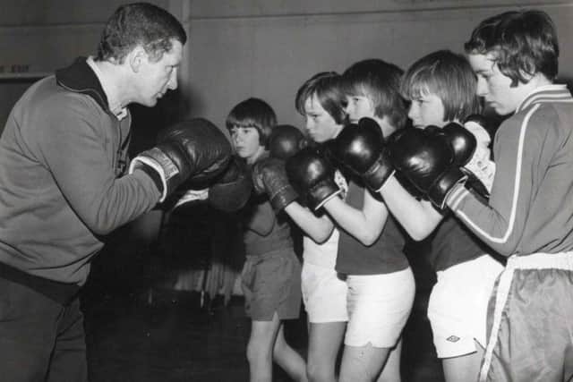 Jackie Brown with a group of youngsters he was coaching. Picture courtesy of Brown family.