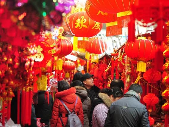 The colour red was used to ward off the evil beast, which is why you'll see it everywhere around New Year's Day. Picture: STR/AFP via Getty Images