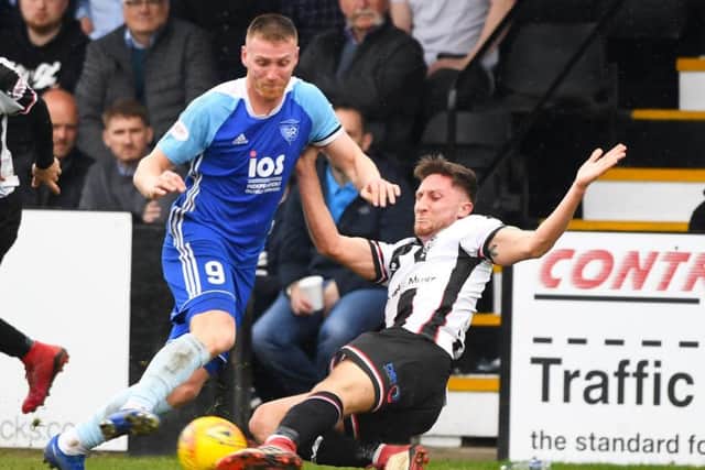 Rory McAllister, left, in action for Peterhead. Picture: SNS