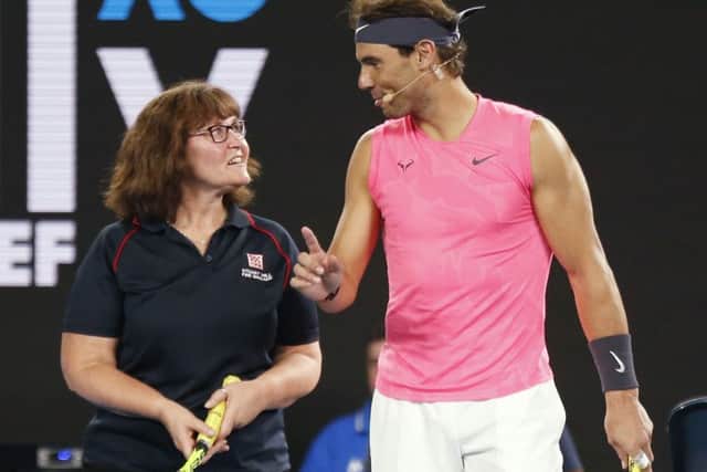 Rafa Nadal gives firefighter Deb some tennis tips at the Rally for Relief Bushfire Appeal event. Picture: Darrian Traynor/Getty