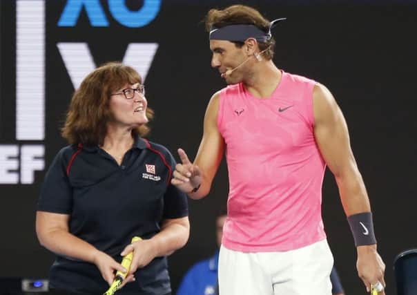 Rafa Nadal gives firefighter Deb some tennis tips at the Rally for Relief Bushfire Appeal event. Picture: Darrian Traynor/Getty