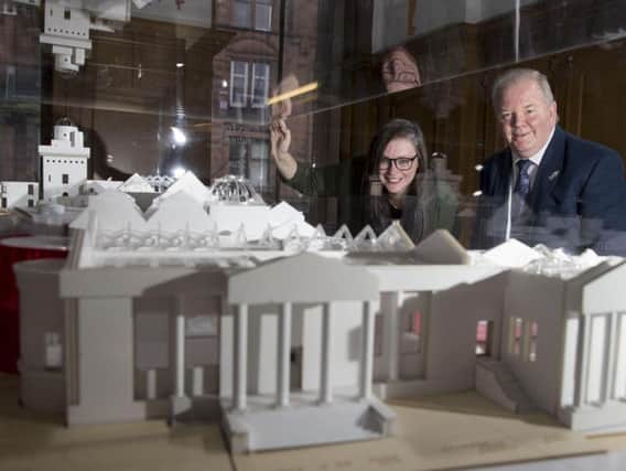 Lisa-Marie Hughes, chair of Renfrewshire Leisure, and Martyn Wade, a member of the Scotland committee at the National Lottery Heritage Fund, look over the plans for the revamped museum.