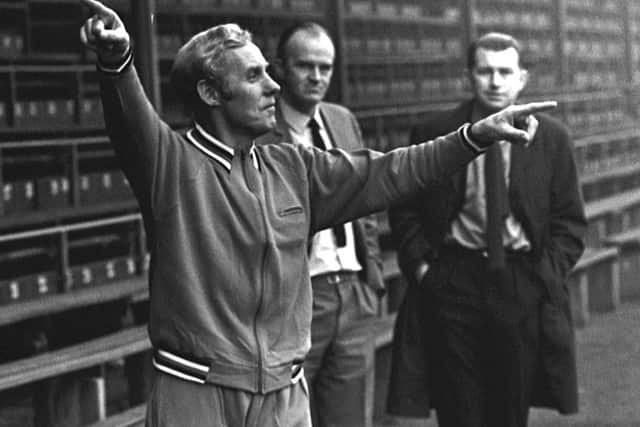Bobby Brown in full flow, watched by Ernie Walker and Willie Waddell. Picture: SNS