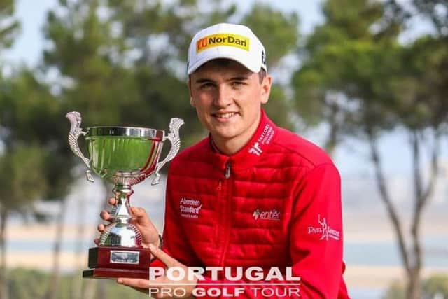 Sam Locke shows off the trophy after his win on the Portugal Pro Golf Tour