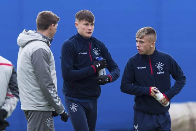 Rangers manager Steven Gerrard, left, chats to Nathan Patterson and Kai Kennedy, right, during a training session ahead of the William Hill Scottish Cup fourth round tie against Stranraer at Ibrox. Picture: Paul Devlin/SNS