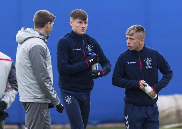 Rangers manager Steven Gerrard, left, chats to Nathan Patterson and Kai Kennedy, right, during a training session ahead of the William Hill Scottish Cup fourth round tie against Stranraer at Ibrox. Picture: Paul Devlin/SNS