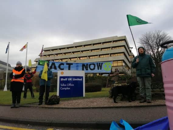 Climate change activists blocked the entrance to the headquarters of oil giant Shell in Aberdeen.