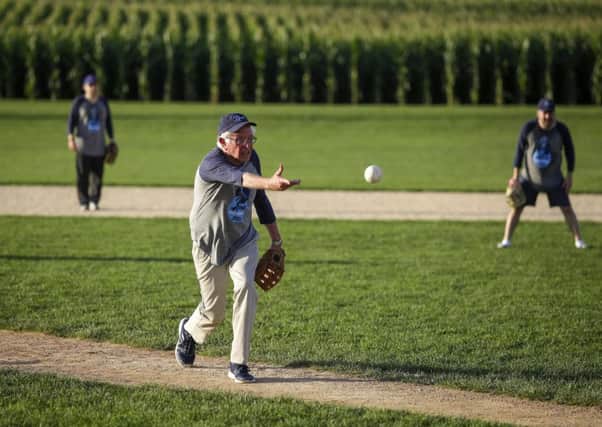 Bernie Sanders pitches on the baseball field built for the film Field of Dreams in Dyersville (Picture: Joshua Lott/Getty Images)