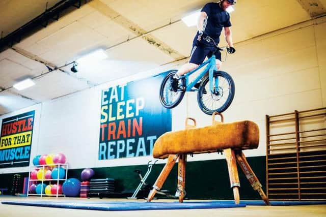 MacAskill does tricks on the equipment in his latest video, Gymnasium