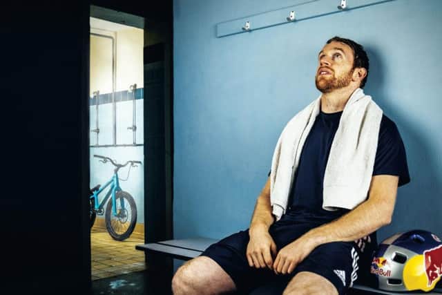 MacAskill takes a breather after his workout in Gymnasium. Each of his stunts takes hours of repetition and practise.