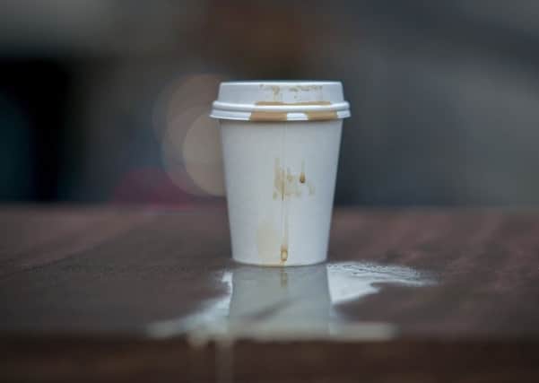 MANCHESTER, ENGLAND - JANUARY 05: In this photo illustration a disposable coffee cup sits on a wall on January 05, 2018 in Manchester, England. Some members of the UK Parliament are calling for a 25p levy on all disposable coffee cups to drive consumers to the re-usable variety and to fund the costs of recycling. (Photo illustration by Christopher Furlong/Getty Images)
