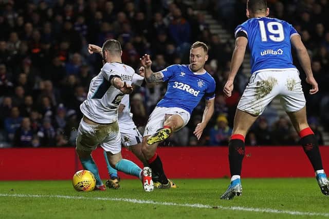 Midfielder Scott Arfield slots home Rangers' first goal against Stranraer shortly before half-time at Ibrox. Picture: Ian MacNicol/Getty