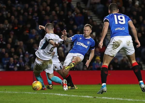 Midfielder Scott Arfield slots home Rangers' first goal against Stranraer shortly before half-time at Ibrox. Picture: Ian MacNicol/Getty