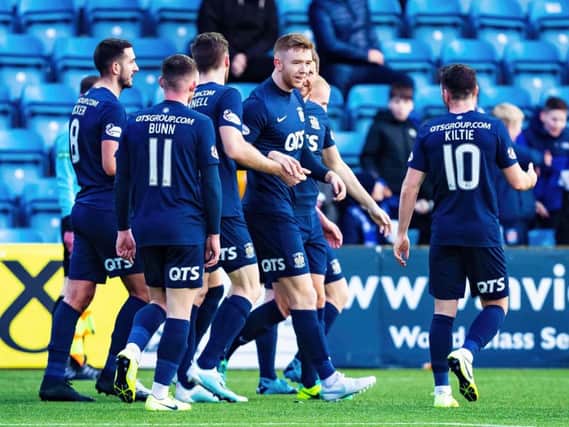 Stuart Findlay celebrates scoring with his teammates.