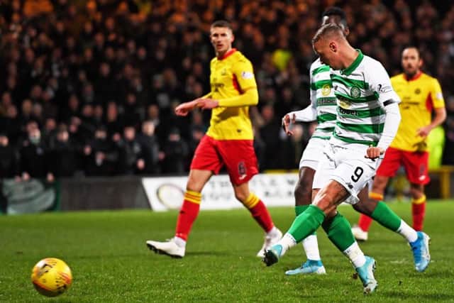 Leigh Griffiths sidefoots home Celtic's opening goal at Firhill as his team won their 32nd cup tie in a row. Picture: Craig Williamson/SNS