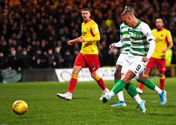 Leigh Griffiths sidefoots home Celtic's opening goal at Firhill as his team won their 32nd cup tie in a row. Picture: Craig Williamson/SNS