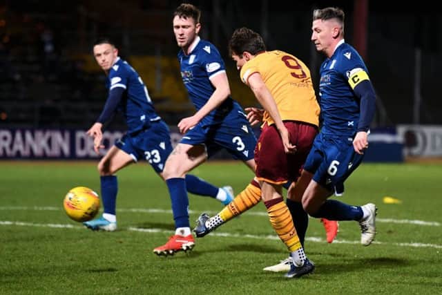 Christopher Long sweeps home the second goal of his hat-trick. Picture: Craig Foy / SNS