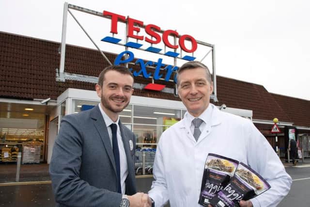 From left: Tesco's James Lamont with Simon Howie. Picture: Perthshire Picture Agency.