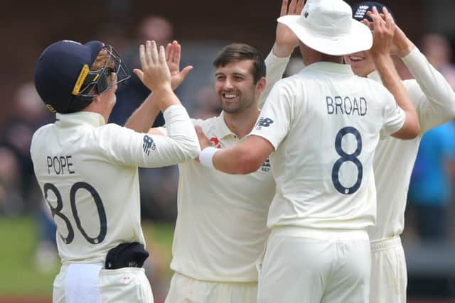 England bowler Mark Wood celebrates with team-mates after Stuart Broad had caught Kagiso Rabada. Picture; Stu Forster/Getty