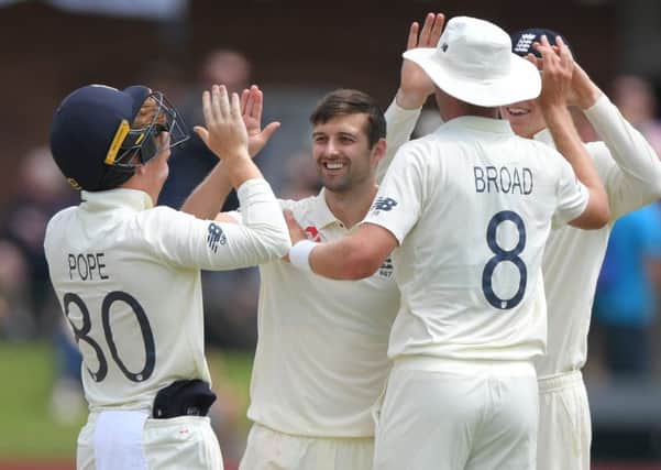 England bowler Mark Wood celebrates with team-mates after Stuart Broad had caught Kagiso Rabada. Picture; Stu Forster/Getty