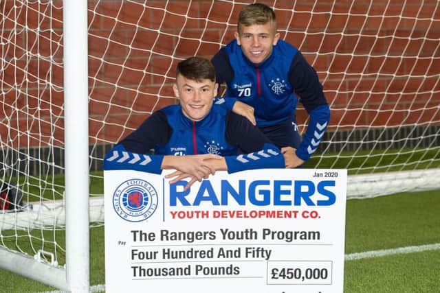 Nathan Patterson, left, and Kai Kennedy with a £450,000 donation for Rangers youth academy. Picture: Ross MacDonald/SNS
