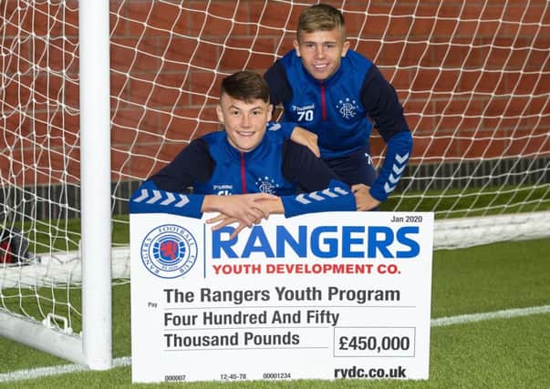 Nathan Patterson, left, and Kai Kennedy with a £450,000 donation for Rangers youth academy. Picture: Ross MacDonald/SNS