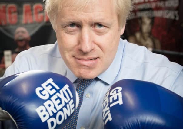 Boris Johnson during a visit to Jimmy Egan's Boxing Academy at Wythenshawe during the general election campaign (Picture: Stefan Rousseau/PA Wire)
