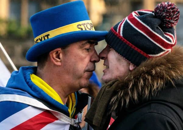 A nation divided: A pro-Brexit and a pro-EU demonstrator get to know each other (Picture: Jack Taylor/Getty Images)