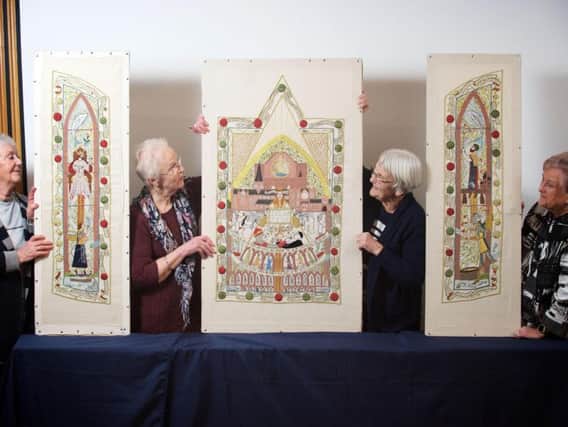 Embroiderers admire their work on the new Declaration of Arbroath tapestry which marks 700 years since the signing of the historic document which asserted Scotland's independence and called for Robert the Bruce to be recognised as its lawful king. PIC: HES.