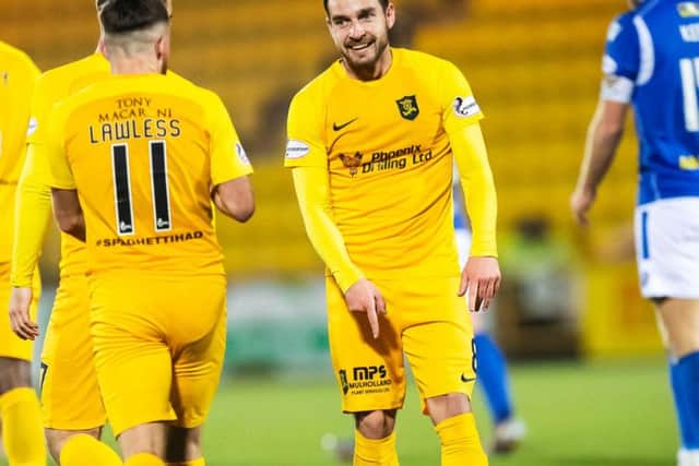 Scott Pittman celebrates after scoring the opener for Livingston. Picture: SNS