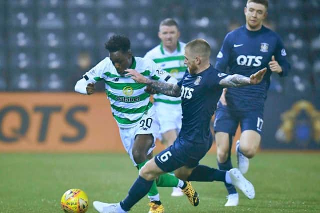 Jeremie Frimpong, left, was injured after a tackle by Kilmarnock's Alan Power. Picture: SNS