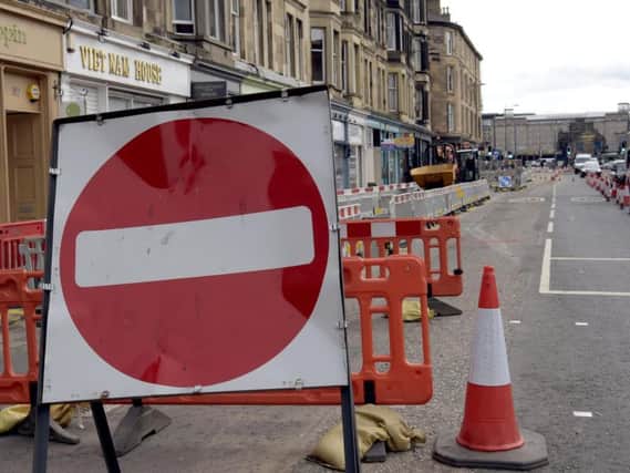 Utility firms are required to lodge details of progress with roadworks. Picture: Lisa Ferguson