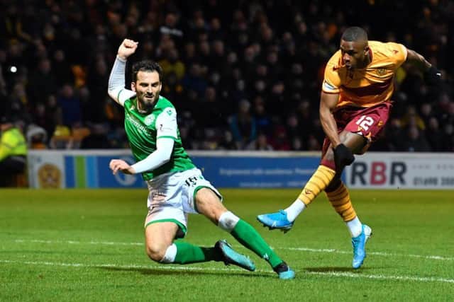 Motherwell's Christy Manzinga see's his effort rattle off the crossbar