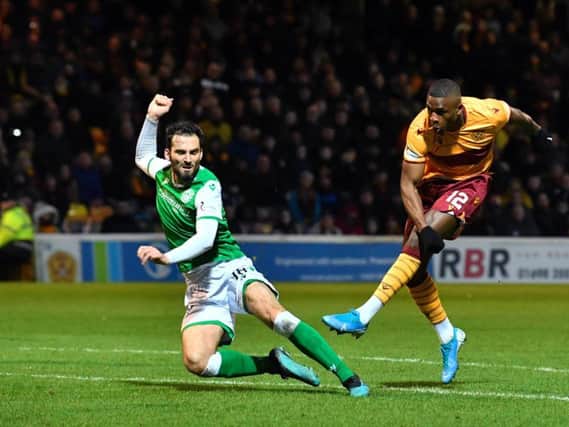 Motherwell's Christy Manzinga see's his effort rattle off the crossbar