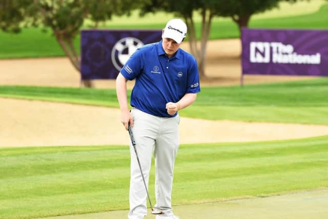 Bob MacIntyre reacts to holing a putt in the final round of the Omega Dubai Desert Classic at Emirates Golf Club