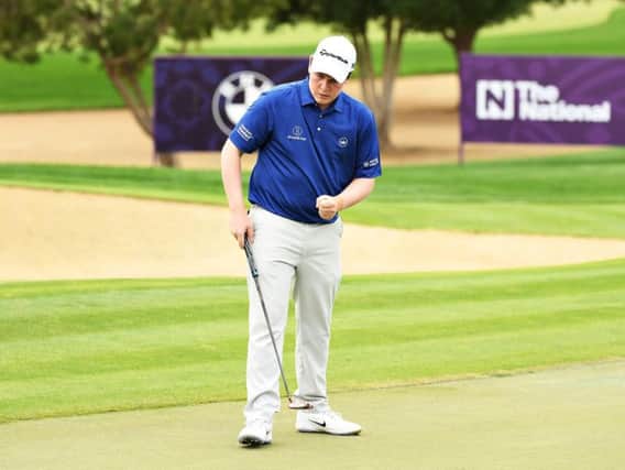 Bob MacIntyre reacts to holing a putt in the final round of the Omega Dubai Desert Classic at Emirates Golf Club
