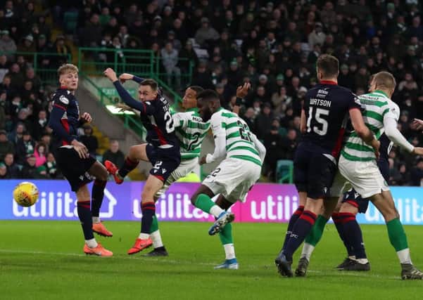 Odsonne Edouard puts Celtic 2-0 in front against Ross County shortly after coming on as a second-half substitute. Picture: Andrew Milligan/PA
