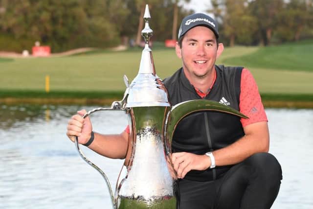 Australian Lucas Herbert with the iconic coffee pot after his play-off win at Emirates Golf Club