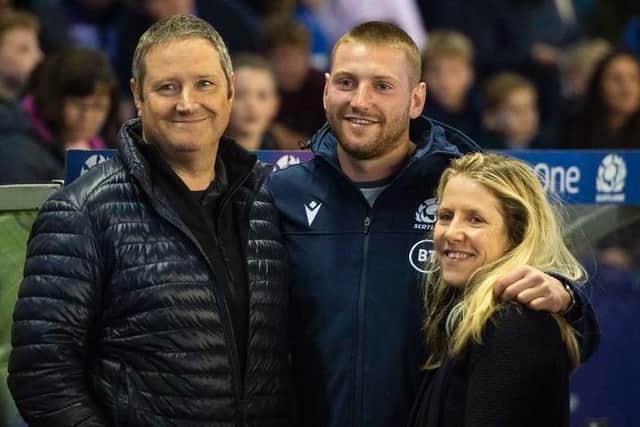 Finn Russell with his dad Keith and mum Sally at last summer's Scotland v Georgia final World Cup warm-up Test at Murrayfield. Picture: SRU/SNS
