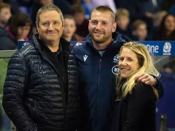 Finn Russell with his dad Keith and mum Sally at last summer's Scotland v Georgia final World Cup warm-up Test at Murrayfield. Picture: SRU/SNS