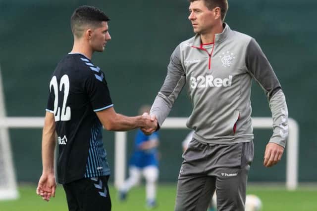 Jordan Jones, left, is reportedly heading out of Ibrox as Steven Gerrard targets a new signing before the end of the window. Picture: SNS