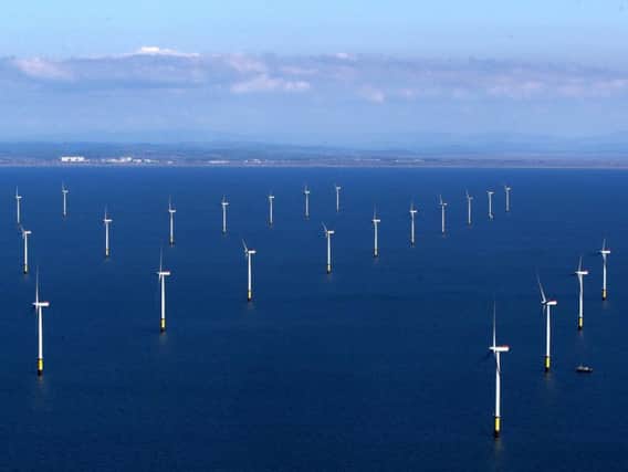 Wind and solar power account for 96 per cent of all investment in renewables by the sample companies. Picture: Peter Byrne